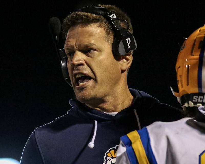 Lyons head coach Jon Beutjer motivates the team during football game between Hinsdale Central at Lyons.  Sept 8, 2023.