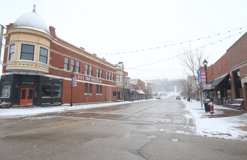 Snow falls along Mill Street on Monday, March 16, 2026 in Utica.
