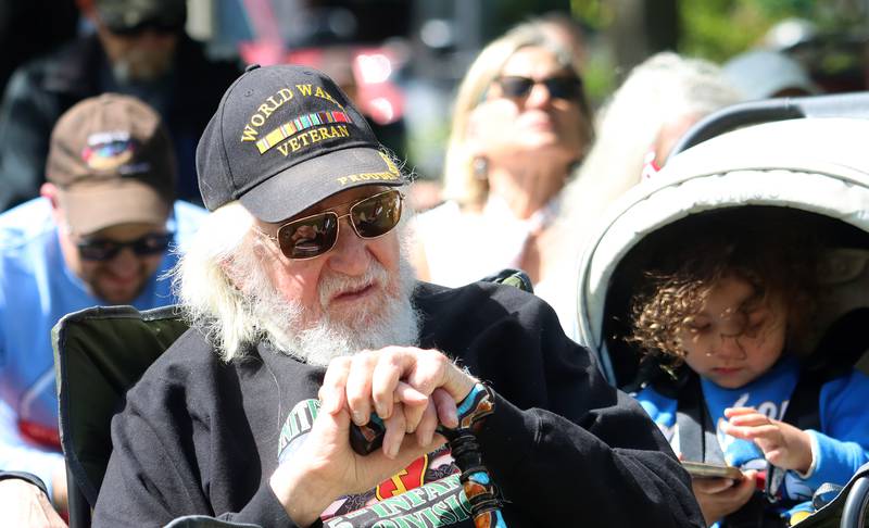Ninety-seven-year-old Al Frank of Bull Valley listens during a Memorial Day service and parade in downtown Woodstock on Monday, May 26, 2025. Frank served during World War Two with the Army from 1943-1947