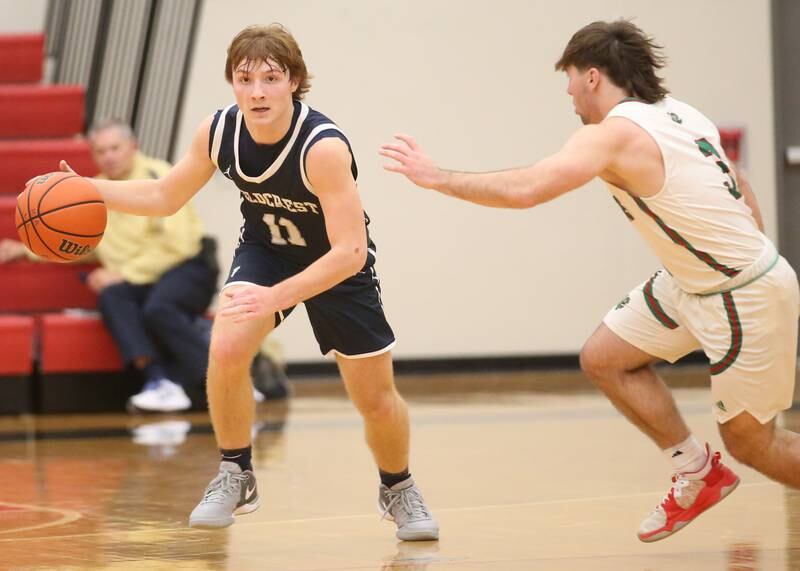 Fieldcrest's Nathan Cook dribbles up the floor as L-P's Brady Romagnoli defends during the 49th annual Colmone Classic on Friday, Dec. 8, 2023 at Hall High School.