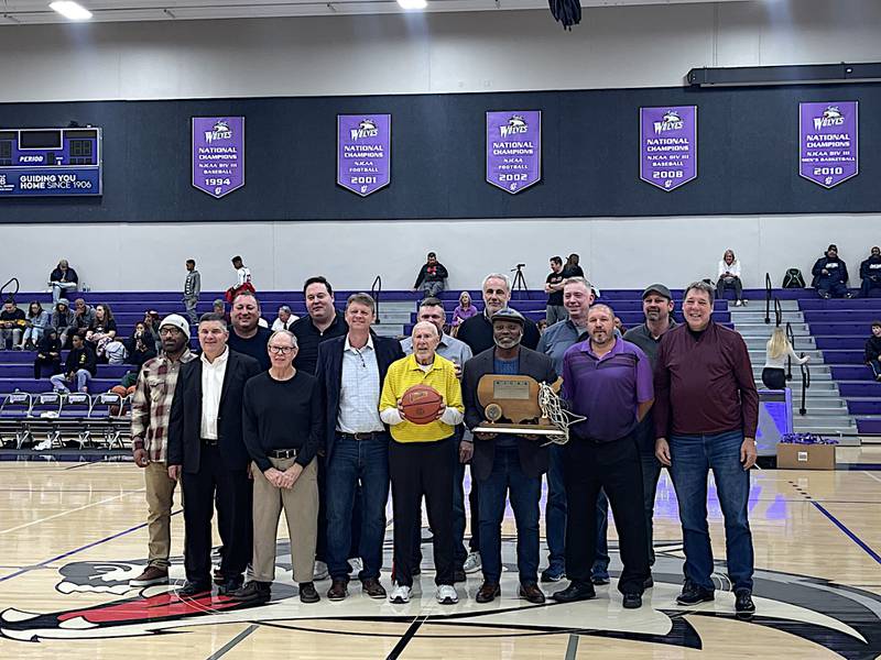 Several members of JJC's 1993-94 NJCAA Division II national championship basketball team were honored Saturday. From left: Dewey Dwyer, Dave Parker, Aaron Schram, John Jones, Ivan Colbert, Bob Krahulik, and Pat Klingler. Back row, from left: Mark Bass, Paul Kobialko, Kelly Lynch, Craig Brunes, Haris Mujezinovic, Frank Schoenauer, and Chris Fisher. Not in attendance were Paul Nondas and Eric Cooper.