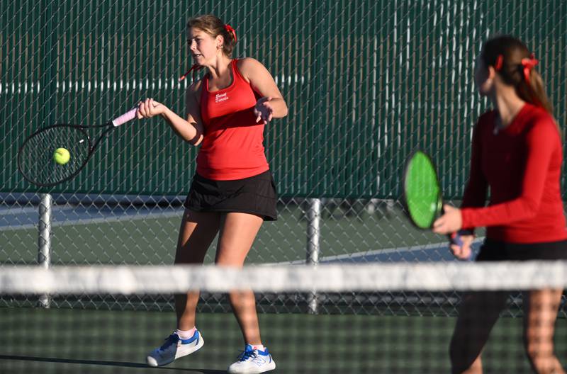 Benet Academy’s Natalie Grover, playing with teammate  Katie Jendra, returns the ball during Class 1A doubles third-place match of the girls state tennis tournament at Hersey High School on Saturday, Oct. 26, 2024 in Arlington Heights.