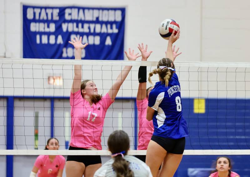 Hall's Caroline Morris defends the net against Princeton's Keighley Davis Thursday at Prouty Gym.