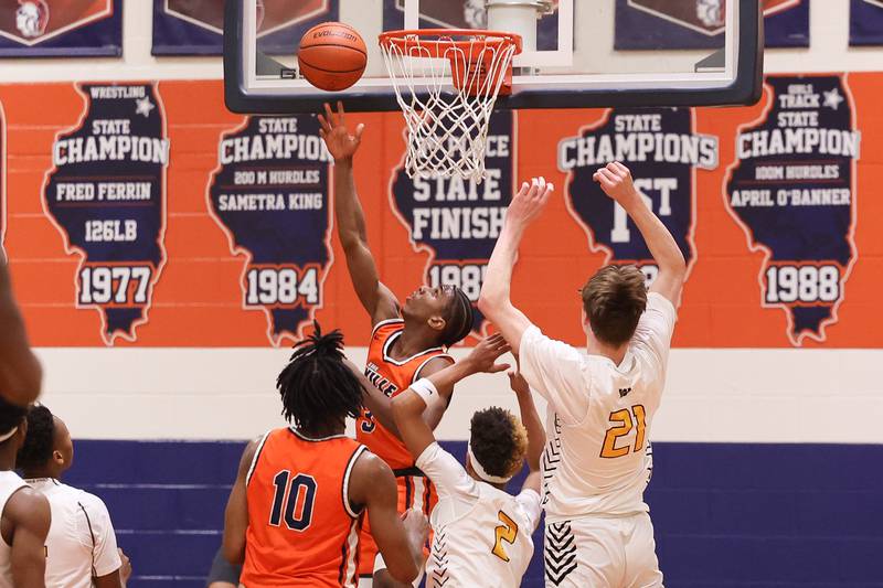Romeoville’s Meyoh Swansey get in for the reverse layup against Joliet West on Tuesday January 31st, 2023.