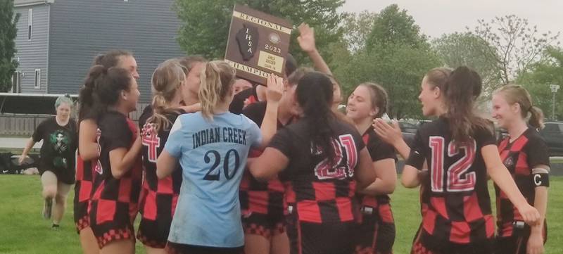 The Indian Creek girls soccer team celebrates after the team's 2-1 win against Oregon to claim the Class 1A Indian Creek Regional championship on Friday, May 12, 2023 in Waterman. The regional crown is the first for the Timberwolves since 2014.