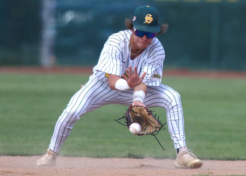 Crystal Lake South’s Christian Alther fields an infield grounder against Lake Forest in Class 3A baseball regional action at Crystal Lake Thursday.