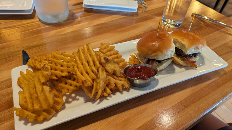 The sliders and waffle fries at Tapa La Luna in DeKalb.