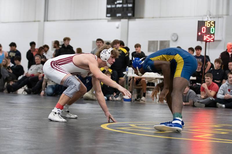Wheaton Academy's Tyler Jones, left, and Altoff Belville's Pierre Walton wrestle in the 165-pound championship match during the Reed-Custer Comet Classic Wrestling Invite on Saturday, Jan 17.