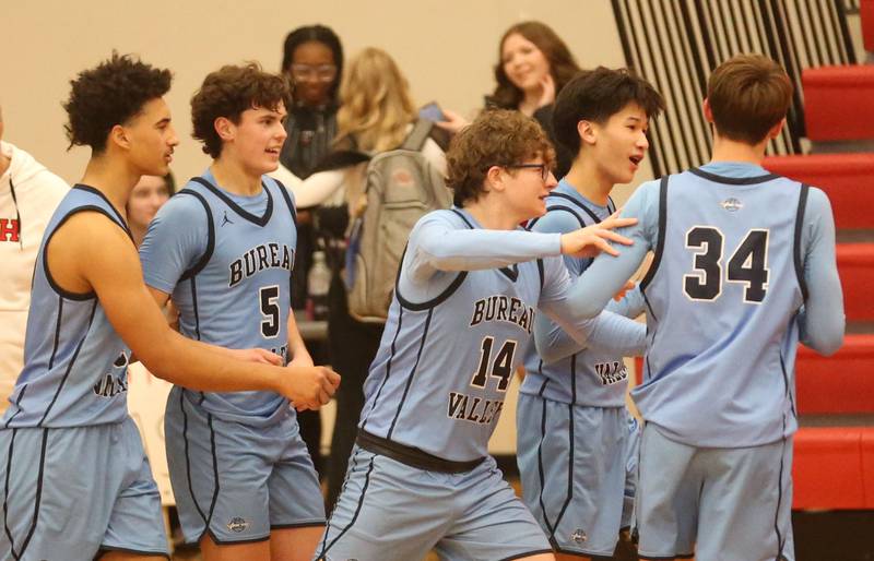 Members of the Bureau Valley boys basketball team (from left) Dakarai Martin, Logan Philhower, Drake Taylor, CArter Chhim and Carson Gruber react after defeating Hall on Wednesday, Jan. 28, 2026 at Hall High School.
