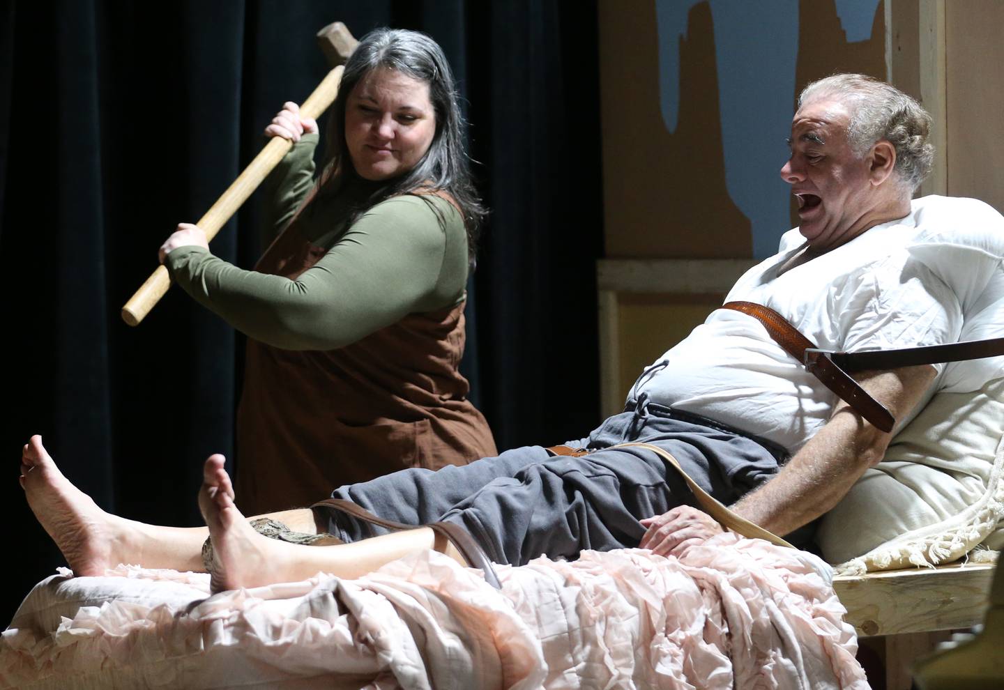 Michele McClane and Jeff Sudakov act out a scene during a rehearsal of "Misery" on Thursday, Oct. 24, 2024 at Stage 212 in La Salle. "Misery" is a play based on Stephen King's novel of the same name, adapted by William Goldman. It tells the story of Paul Sheldon, a popular romance novelist who is rescued from a car crash by his biggest fan, Annie Wilkes, and held captive in her secluded home.  “Misery” will be presented from Nov. 8 to 10 and 15 to 17 at Stage 212, 700 First St., La Salle. Friday and Saturday performances begin at 7:30 p.m., and a Sunday matinees begin at 2 p.m. Tickets will be available to the general public for $17 beginning Oct. 28 and can be bought by visiting the box office from 4 to 6 p.m. Monday and from 9 a.m. to noon Saturday, or by calling 815-224-3025 during those hours. Tickets also can be bought online by visiting stage212.org.