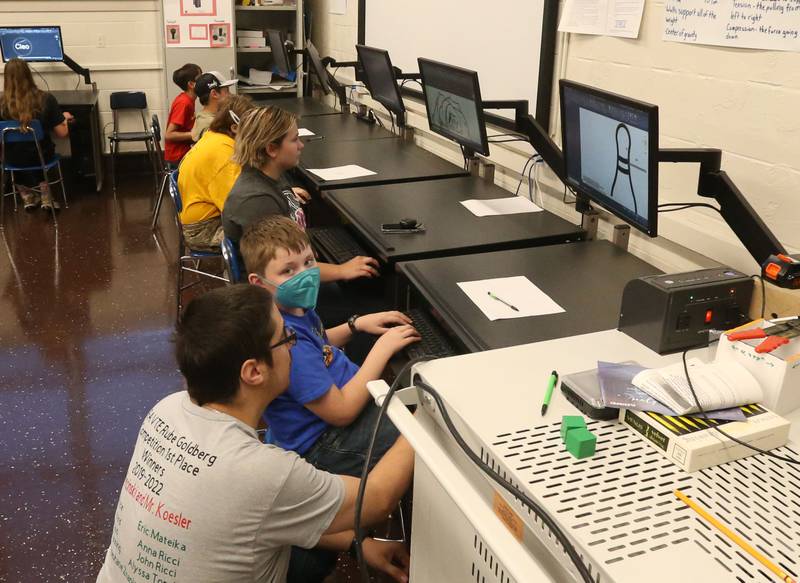 Andrew Wiercinski engineer design instructor teaches students how to draw objects and print them using a 3D printer during the Area Career Center Hands-On Showcase on Thursday, June 8, 2023 at La Salle-Peru Township High School.