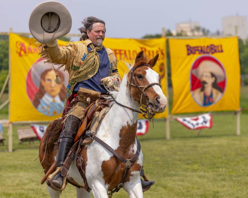 An actor portraying Buffalo Bill opens the show with a running pass on his horse by the fans during the Buffalo Bill's Wild West Extravaganza on May 31, 2025 at Jamie's Outpost in Utica.