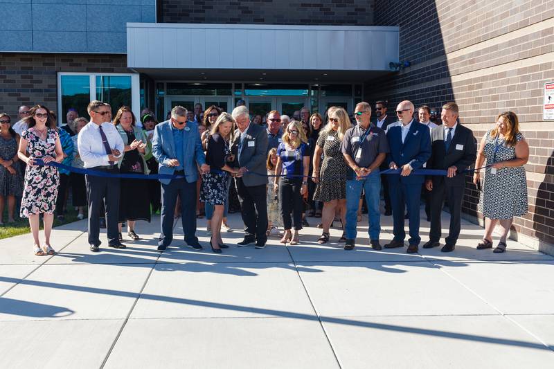 District 300 Superintendent Susan Harkin and board member Joe Stevens cut the ribbon during an August 30, 2022 celebration to recognize the opening of Big Timber Elementary School in Hampshire.