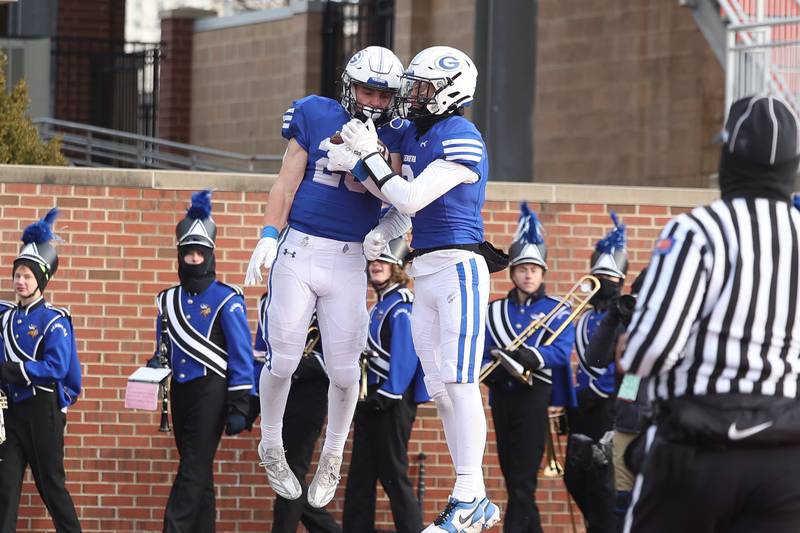 Geneva’s Michael Rumoro (20) celebrates his touchdown against East St. Louis in the Class 6A state championship on Saturday, Nov. 30, 2024 in Normal.