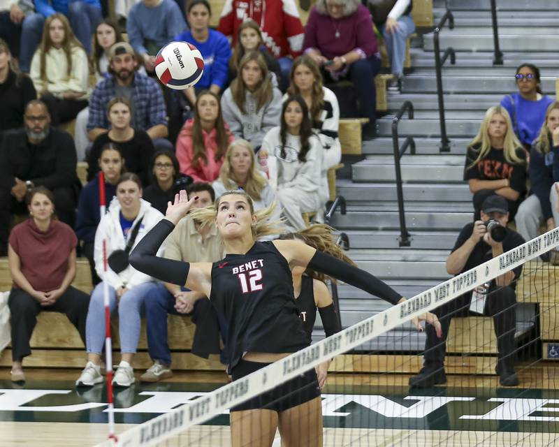 Benet's Carolyn Tarnow (12) eyes a kill during Class 4A Glenbard West Sectional final volleyball match between St Charles North at Benet. Nov 6, 2025 in Glen Ellyn.