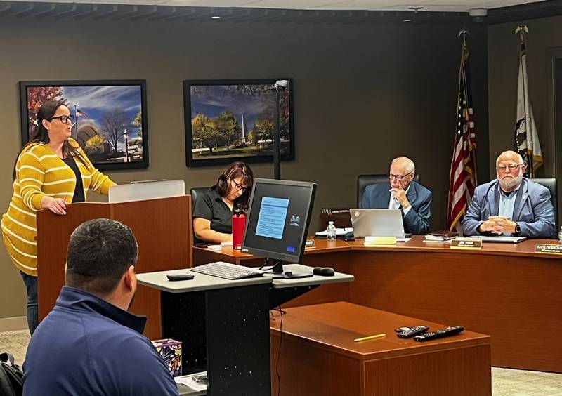 Sterling Building and Zoning Superintendent Amanda Schmidt (far left) provides details about a proposed rental housing code Monday at Sterling City Hall as (seated from left) City Clerk Teri Sathoff, attorney Jim Reese and Alderman Jim Wise listen.