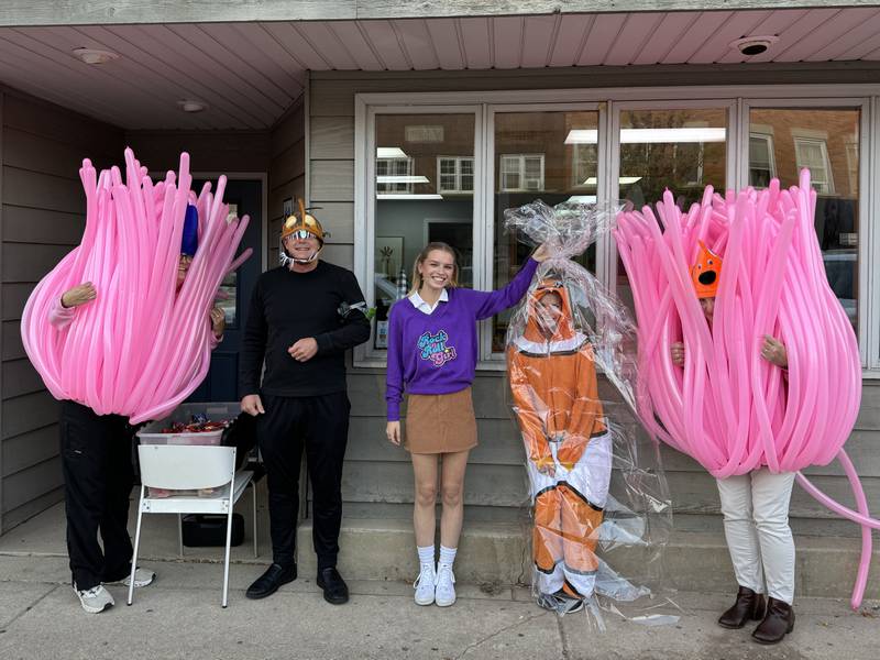 The people at Johnson Pediatrics dressed up as the cast of Finding Nemo, complete with a fishbowl and a sea anenome.