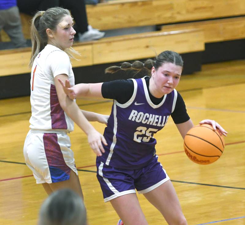 Rochelle's Jaydin Dickey (25) drives around a Genoa-Kingston player at the Oregon Girls Tip-Off Tournament on Wednesday, Nov. 19, 2025 in Oregon.