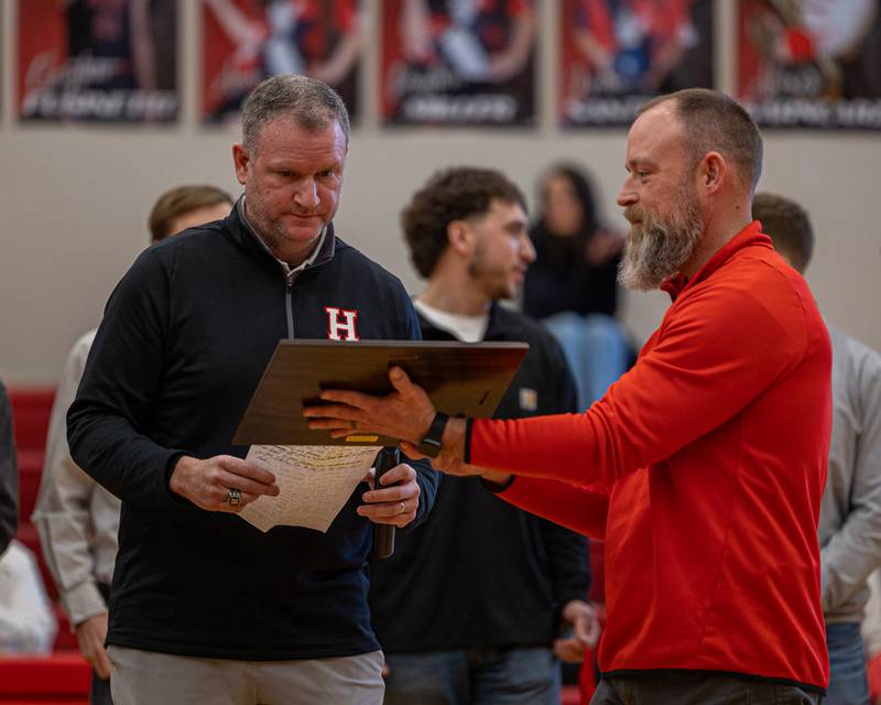 Adam Meyer principal of Hall High presents Head Coach Tom Keegan and the Hall Red Devils 2018 2A State Champions 2026 Hall High School Hall of Fame plaque on Saturday, January 31, 2026 at Hall High School in Spring Valley. Players inducted include Chance Resetich, Brayden DeBates, Cole Wozniak, Christian Stefaniak, Cam McDonald, Sean Riordan, Conner Ripka, Ty Rybarczyk, James Mautino, Matt Hultz, Payton Plym, Devin Soldati, Grant Resetich, Trez Rybarczyk, Jimmy DeAngelo, Gunner McCormick, Brant Vanaman, and Alec Bulak with coaches Tom Keegan, Matt McDonald, Kevin Sangston, Randy Tillman and Rhodes Gorlom.