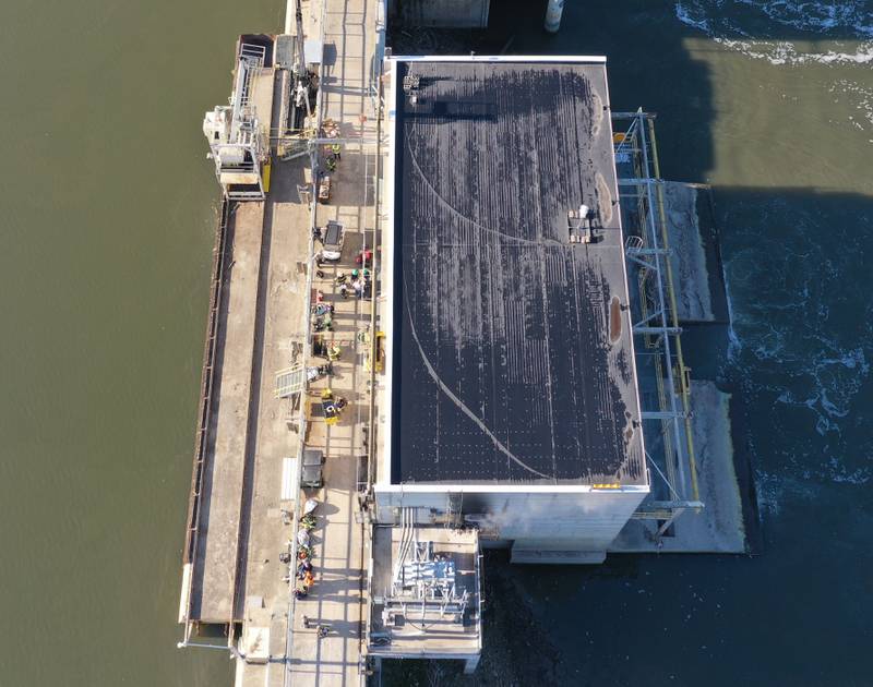 Fire crews work the scene of a fire at the Starved Rock hydroelectric power plant at the Starved Rock Lock and Dam on Tuesday, Oct. 3, 2023 near Utica. A MABAS box alarm was sent out just before 730a.m. for a working fire inside the plant.