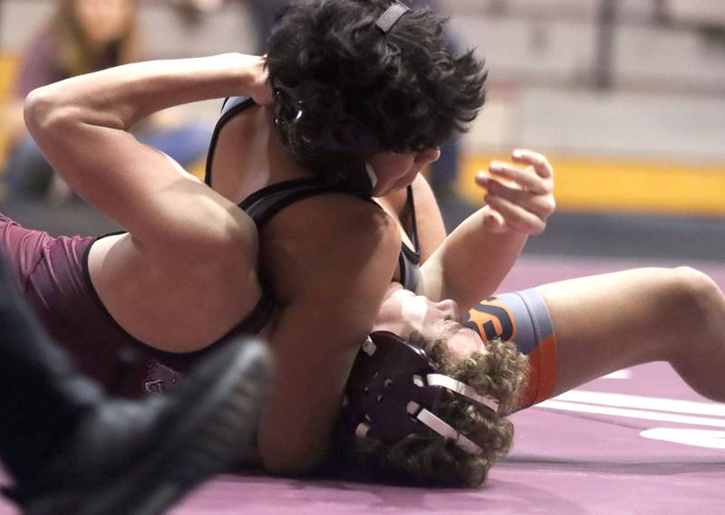 McHenry’s Mayson Chacon pins Prairie Ridge’s Jackson Costa at 126 pounds in varsity boys wrestling on Thursday, Jan. 8, 2026 at Prairie Ridge High School in Crystal Lake.