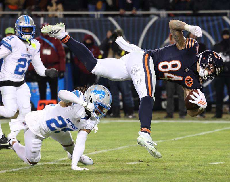 Chicago Bears tight end Colston Loveland is tripped up by Detroit Lions cornerback Avonte Maddox during their game Sunday, Jan. 4, 2026, at Soldier Field in Chicago.