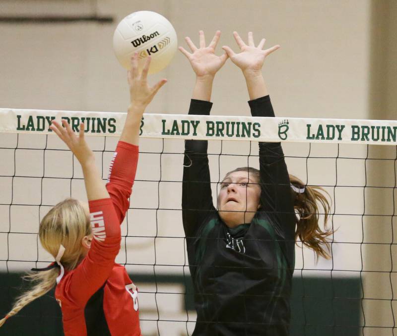 Henry's Talur Homann (8) sends a spike past St. Bede's Isabella Pinter in the Class 1A semifinal game on Wednesday, Oct. 16, 2022 at St. Bede Academy in Peru.