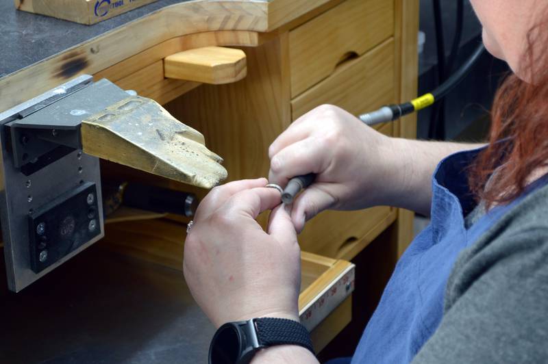 Jen Brooks, owner of Brooks Jewelers, polishes a ring on Saturday, Nov. 2, 2024, in the Oregon-based shop.