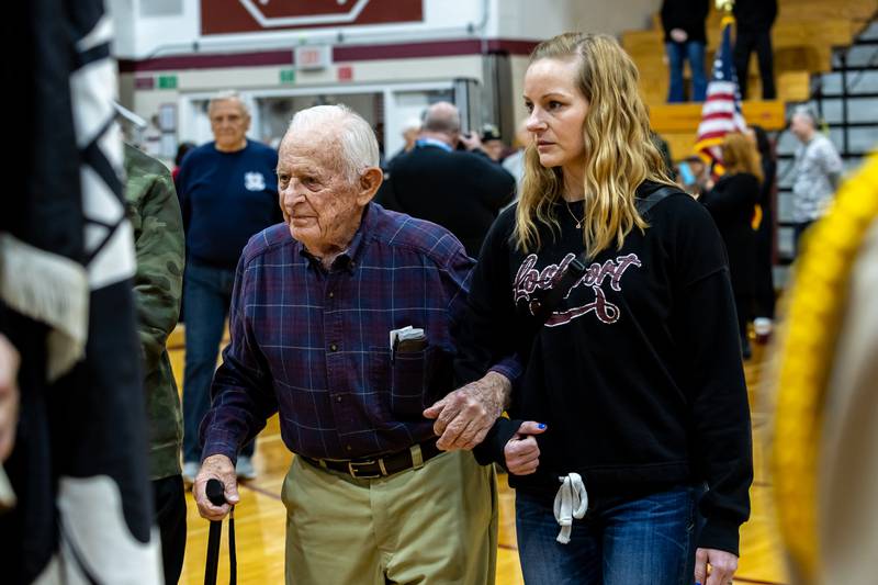 Veteran Sid Skidmore, accompanied by his friend Andrea Collins, is recognized during Lockport Township High School’s 11th Annual Veteran Night Celebration Ceremony on Jan. 23, 2026.