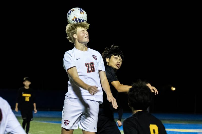 Lincoln-Way Central's Quinn Lauer goes for a header during a Class 3A Boys Soccer Super-Sectional game against St. Laurence at Lyons Township High School’s South Campus on Nov. 3, 2025.