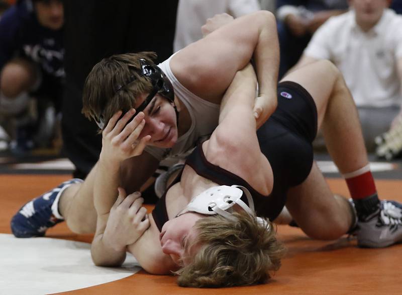 IC Catholic’s Kannon Judycki pins Prairie Ridge’s Jake Lowitzki in the 120-pound championship match in the IHSA 2A Crystal Lake Central Wrestling Sectional on Saturday, Feb. 15, 2025, at Crystal Lake Central High School.