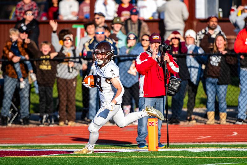 Joliet Catholic Accademy's Keegan Farnaus runs in a touchdown During the 5A Quarterfinals game on Saturday Nov. 11, 2023 at Morris High School