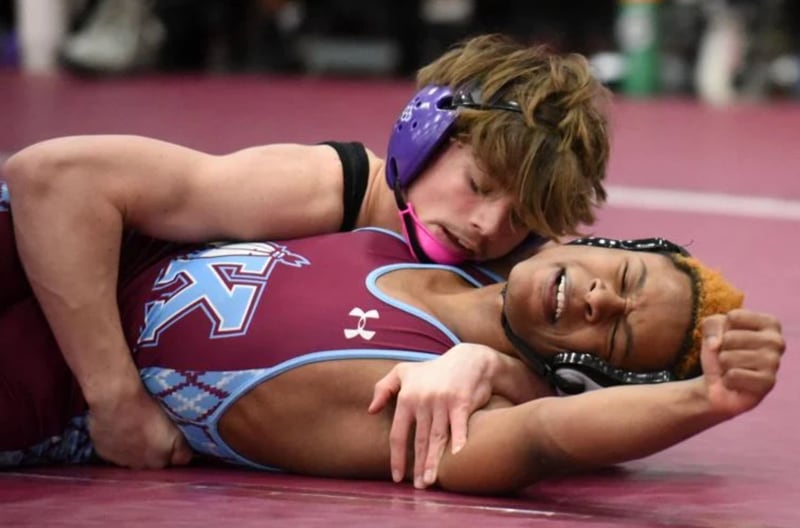 Kankakee's Keonte Theus, right, attempts to keep out of a pin attempt from Manteno's Brady Anders during Wednesday's All-City meet at Kankakee.