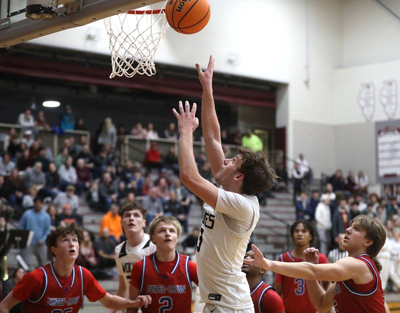 Prairie Ridge's Rory Rezendes shoots the ball in front of the Dundee-Crown defense during a Fox Valley Conference boys basketball game on Friday, Jan. 16, 2026, at Prairie Ridge High School in Crystal Lake.