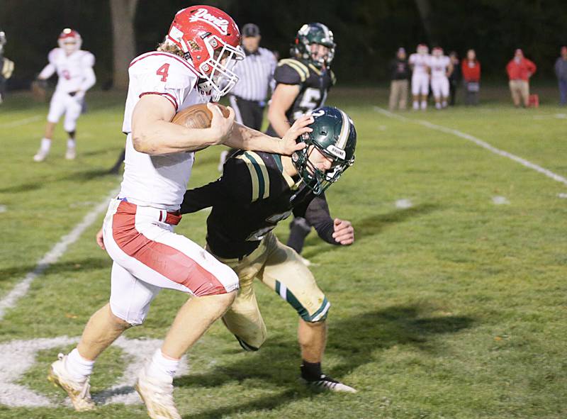 Hall's Mac Resetich (4) stiff arms  St. Bede's Ryan Brady (2) during a a run on Saturday, Oct. 15, 2022 at the Academy in Peru.