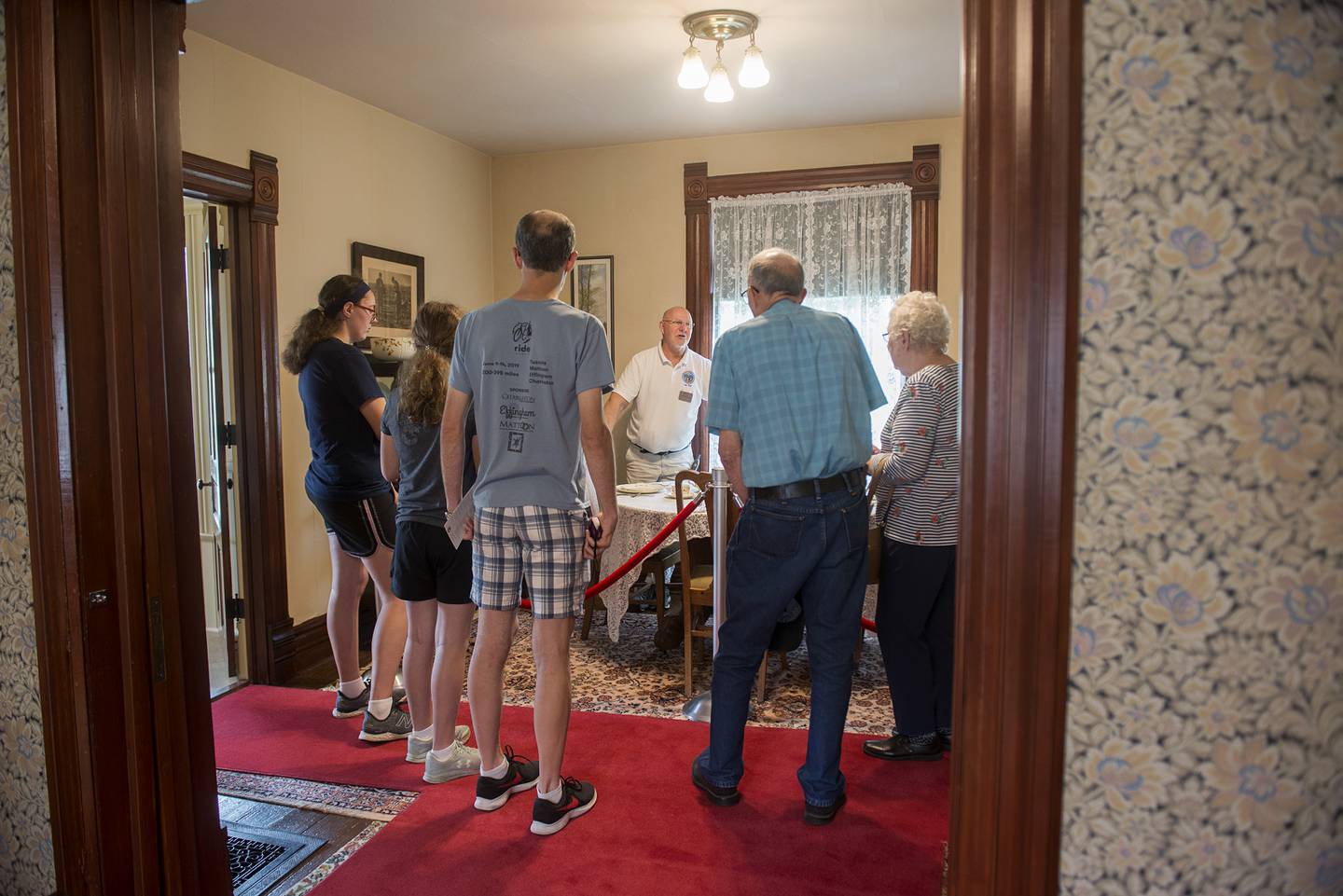 Assistant director Jerry Schnake leads a tour group through the home’s dining room Thursday, July 15, 2021.
