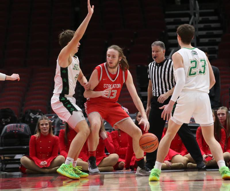 Streator's Quinn Baker dribbles into the lane as he is guarded by Seneca's Lane Provance during a game on Tuesday, Dec. 21, 2023 at the United Center in Chicago.