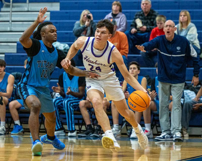 Payton Twait (24) of Serena drives ball towards basket with IMSA's Benjamin Dixson (10) guarding at hip as IMSA's Head Coach Brad Snead reacts in the quarterfinals of the Little Ten Conference Tournament on Monday, Feb. 2, 2026 at Somonauk High School in Somonauk.