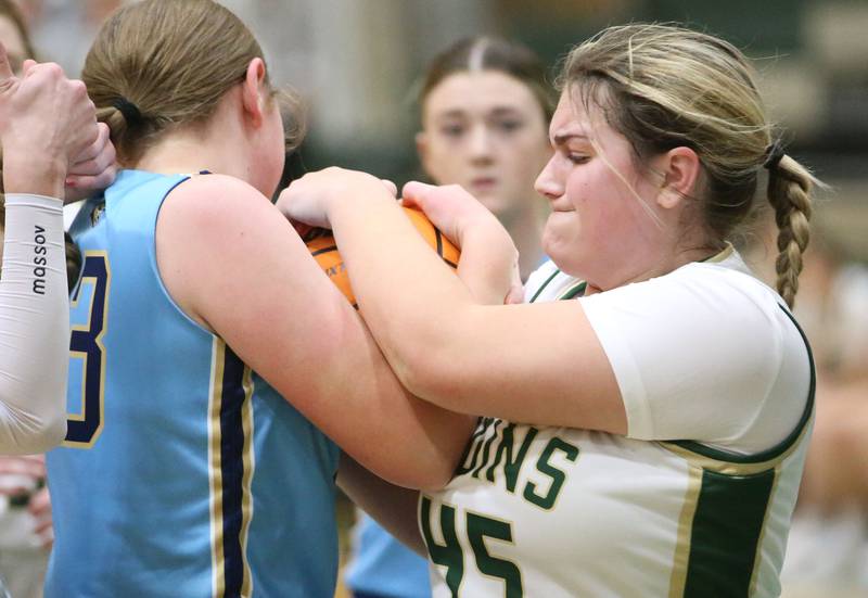 St. Bede's Savannah Bray and Marquette's Kelsey Cuchra force a jump ball on Monday, Dec. 2, 2024 at St. Bede Academy.