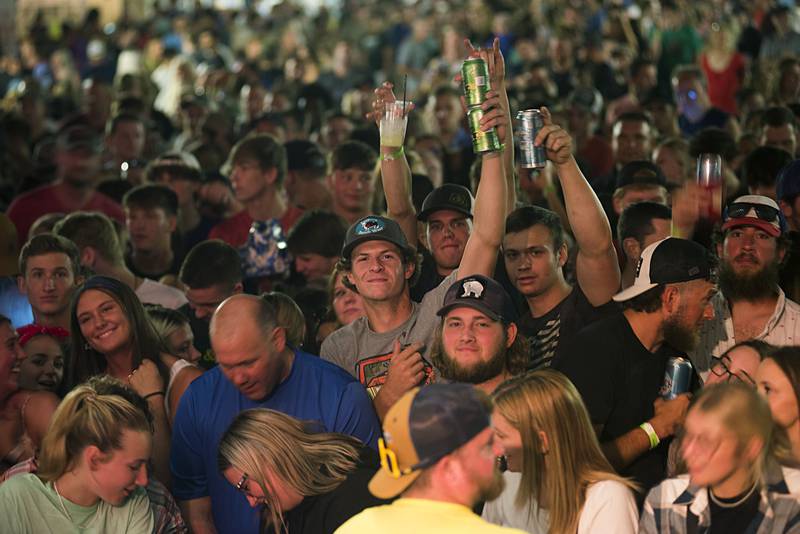 Music fans celebrate Friday night headliner Travis Denning July 1, 2022 at Dixon’s Petunia Fest. Lots more music to be heard on Saturday and Sunday at the festival.