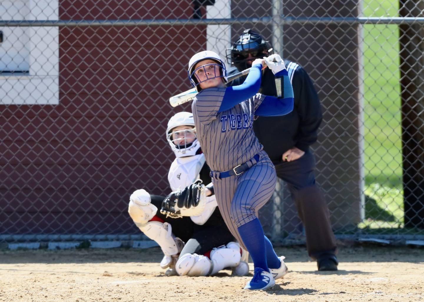 Princeton's Avah Oertel watches her home run ball take flight Saturday at Hall.