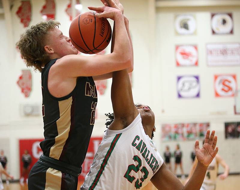 Morris's Gage Phillips and L-P's Maalik Madgrigal fight to pull down a rebound in Sellett Gymnasium on Friday, Jan. 13, 2023 at L-P High School.