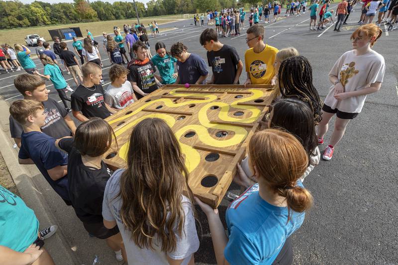 Freshmen from six local high schools work a maze Thursday, Sept. 19, 2024, during a BLIND retreat at Westwood in Sterling.