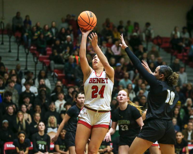 Benet's Emma Briggs (24) puts in a basket during their Class 4A Bolingbrook Sectional final basketball game between Waubonsie Valley at Benet. Feb 27, 2025 in Bolingbrook.