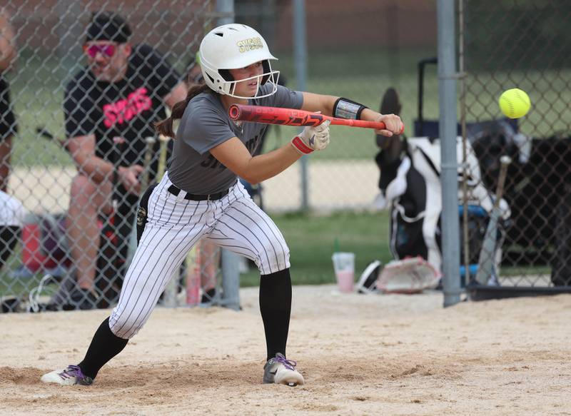 Sycos' Gianna Lovegren lays down a bunt Friday, June 27, 2025, during their 16u game against Select Fastpitch in the Storm Days tournament at the Sycamore Community Sports Complex.