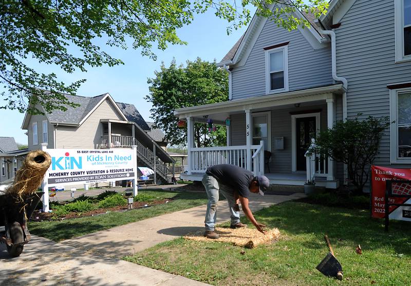 Geovani Balderas of Nissen Contractors, a trade partner of Lennar, plants grass Friday, May 13, 2022, at the Kids in Need of McHenry County home, 55 E. Crystal Lake Ave. in Crystal Lake. About 70 employees of Lennar and their trade partners spent the day working on the home which is used for foster kids to interact with their biological parents in a more comfortable and natural setting.