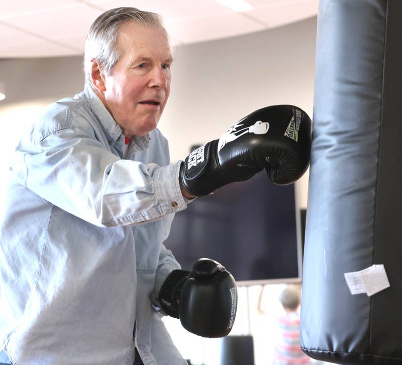 Michael Tiedt punches the heavy bag Friday, April 28, 2023, during Rock Steady Boxing for Parkinson's Disease class at Northwestern Medicine Kishwaukee Health & Wellness Center in DeKalb. The class helps people with Parkinson’s Disease maintain their strength, agility and balance.