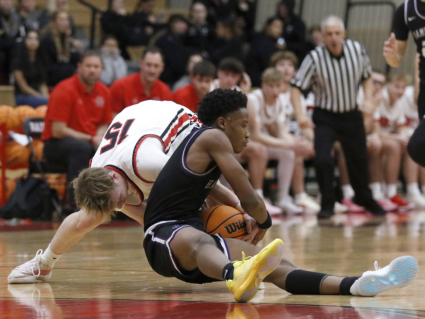 Hampshire's Chayse Gray tries to wrestle the baseball away from Huntley's Aidan Gibbs during a Fox Valley Conference boys basketball game on Friday, Dec. 8, 2024, at Huntley High School.