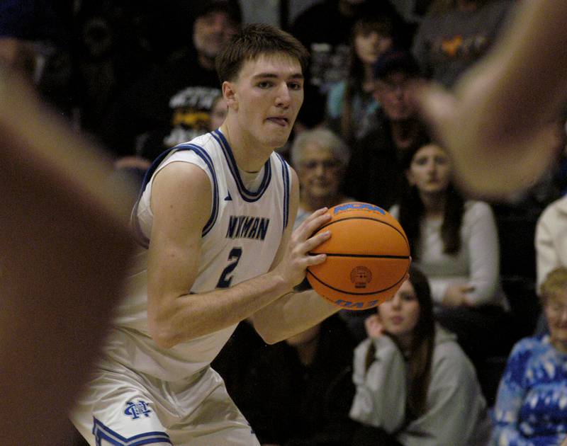 Newman's Asher Ernst looks to pass the ball. The 18-0 Newman Comets defeated  the 14-4 Mendota Trojans 67-66 at Newman High School. The game took place on Tuesday, January 13, 2025.