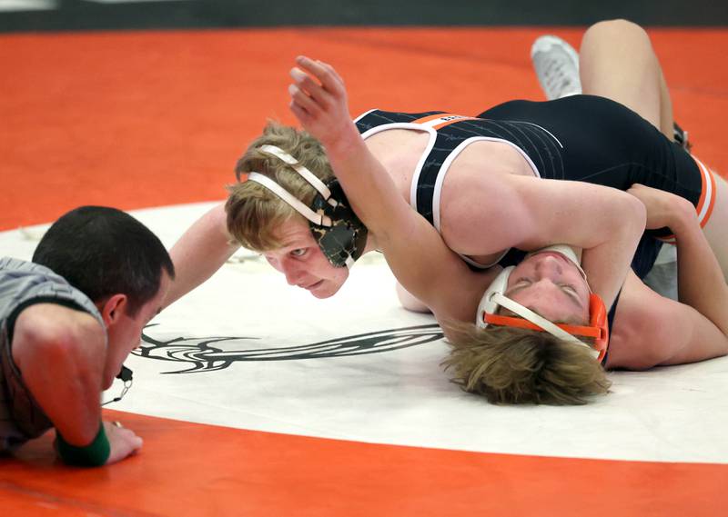 DeKalb’s Hudson Ikens looks to the referee as he pins Naperville North’s Zach Mally in their 132 pound semifinal match Friday, Jan. 20, 2023, during the DuPage Valley Conference wrestling tournament at DeKalb High School.